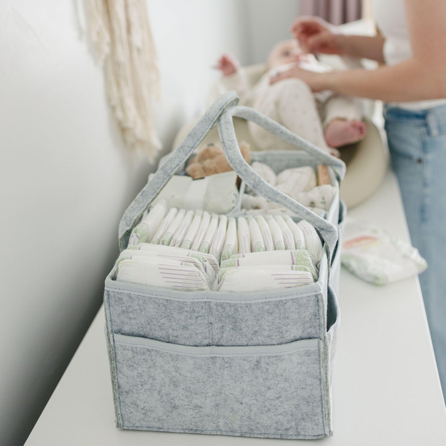 Storage basket for baby items, changing table & care with 8 outside pockets: Baby gift